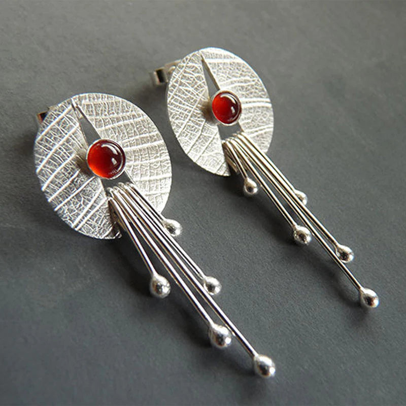 Boucles d'oreilles avec cristal rouge