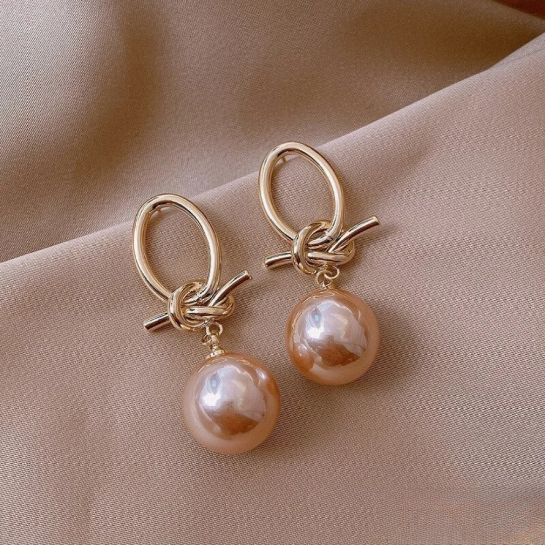 Boucles d'oreilles dorées avec perle