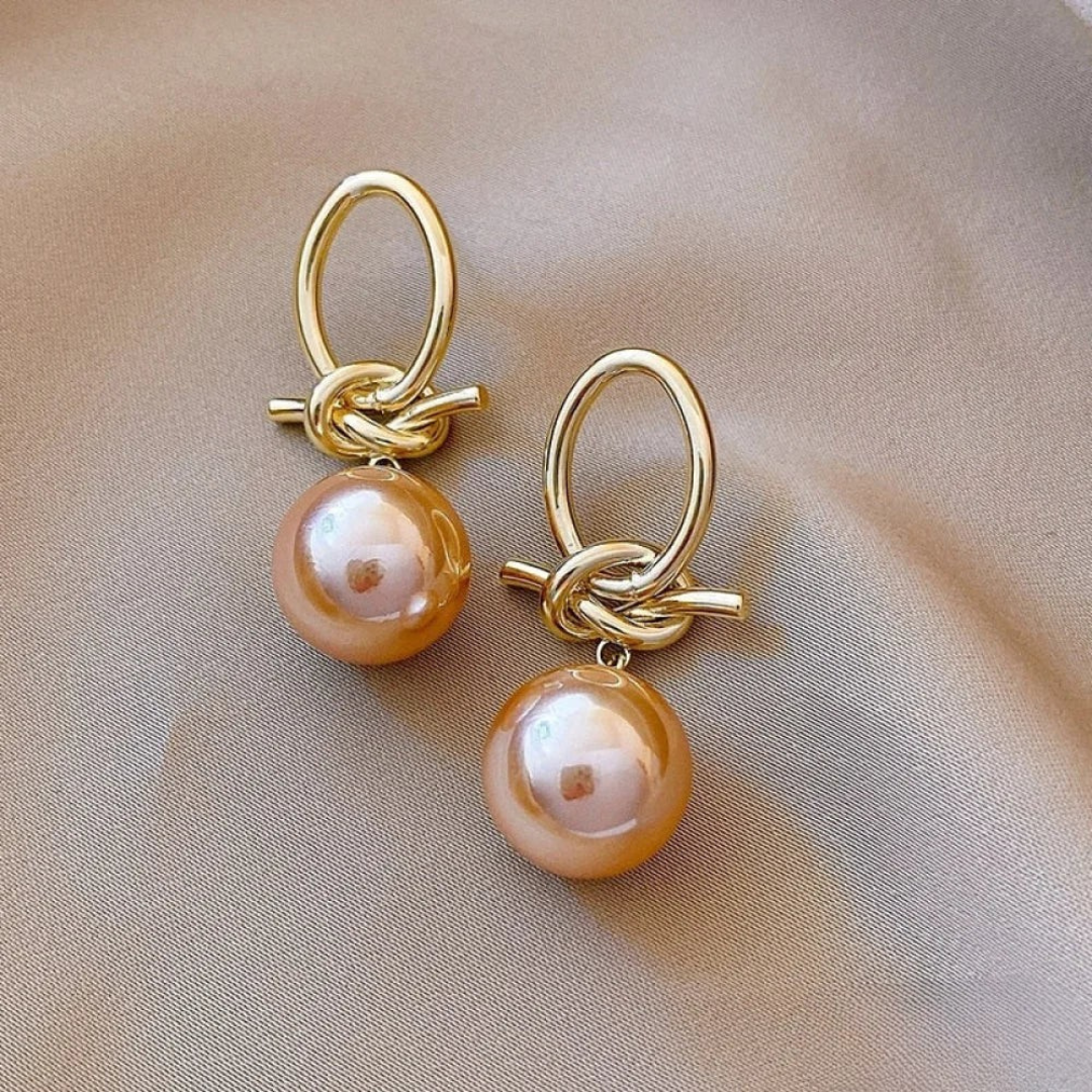 Boucles d'oreilles dorées avec perle