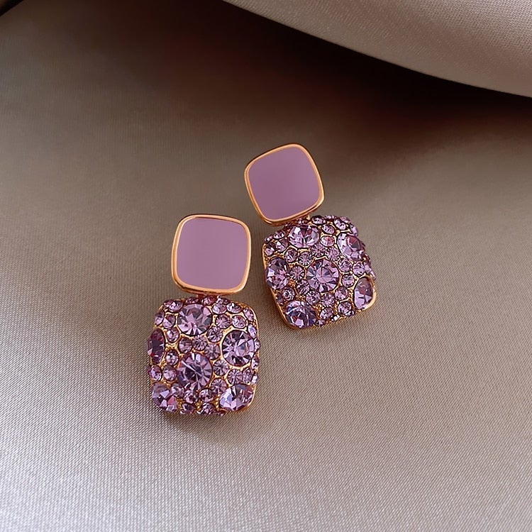 Boucles d'oreilles luxueuses en violet avec incrustation de zircon