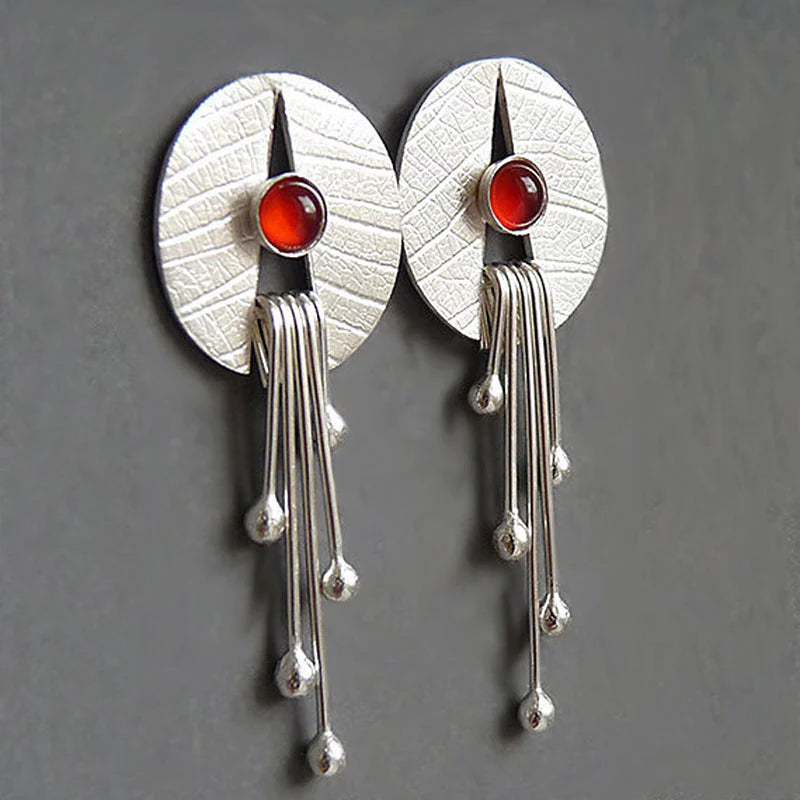 Boucles d'oreilles avec cristal rouge